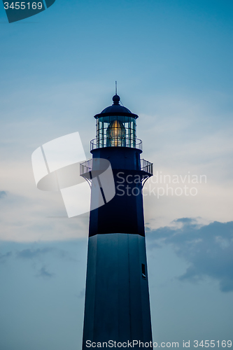 Image of Tybee Island Light with storm approaching