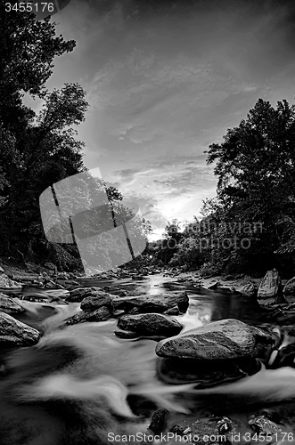 Image of river stream flowing over rocks