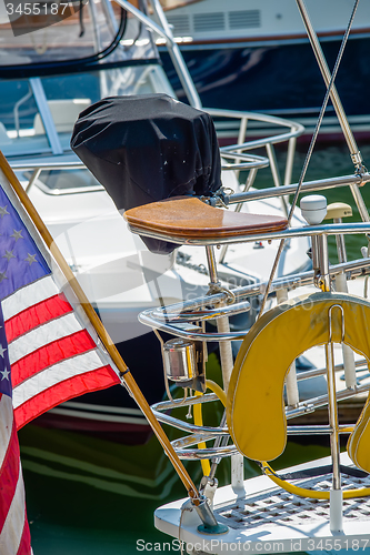 Image of boat captains seat with american flag