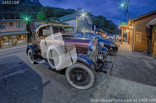 Image of beautiful classic ford car at night on city street