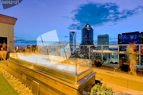 Image of aerial view of charlotte city skyline at sunset