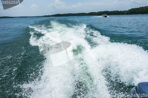 Image of Waves on lake behind the speed boat  