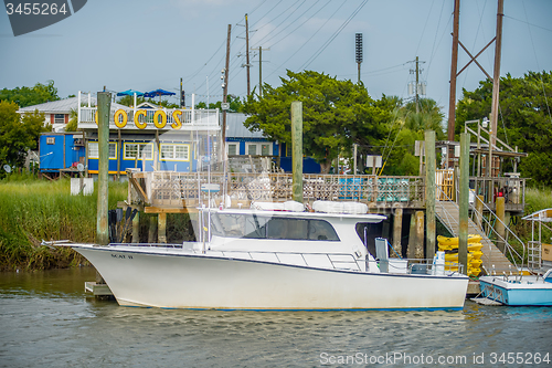 Image of boats and fishing boats in the harbor marina