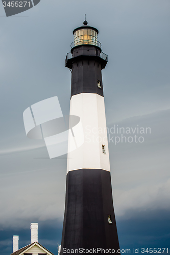 Image of Tybee Island Light with storm approaching