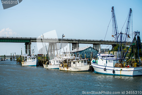 Image of boats and fishing boats in the harbor marina