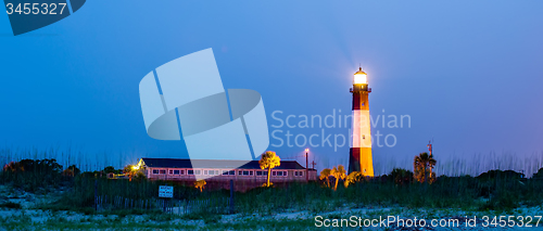 Image of Tybee Island Light with storm approaching