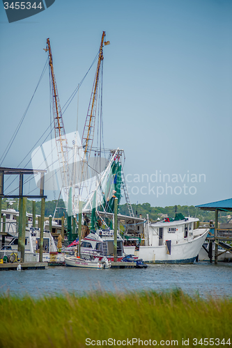 Image of boats and fishing boats in the harbor marina