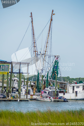 Image of boats and fishing boats in the harbor marina