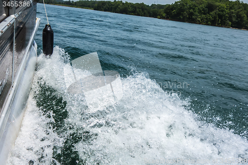 Image of Waves on lake behind the speed boat  