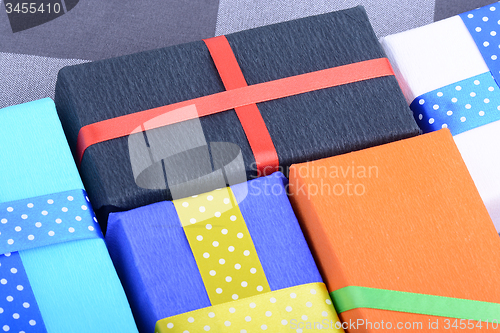 Image of bright gifts with ribbons, holiday invitation card