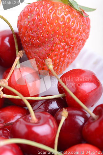 Image of Background from fresh ripe strawberries and cherry