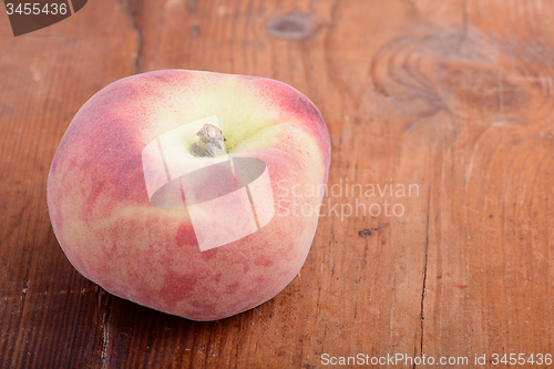 Image of peach set on the wooden background