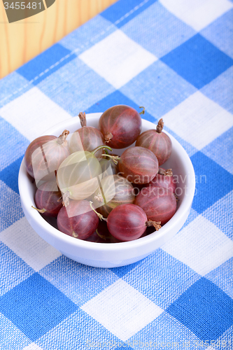 Image of Green gooseberries on white plate