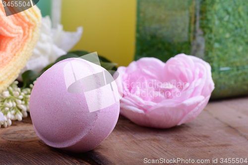 Image of Spa theme with candles and flowers on wooden background