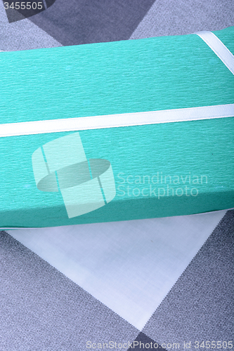 Image of Green gift box with white ribbon