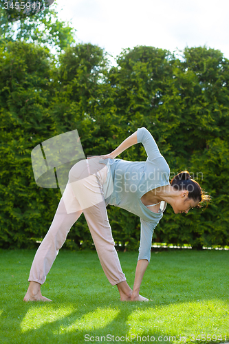 Image of pretty woman doing yoga