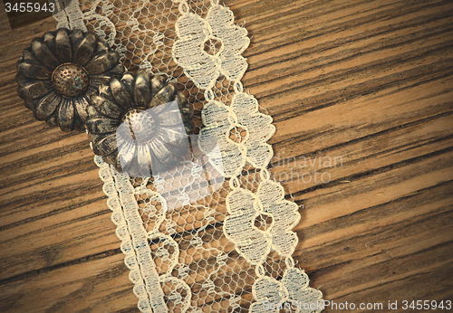 Image of vintage button and lace tape