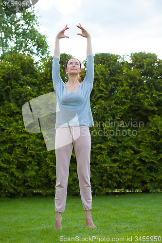 Image of beautiful woman doing yoga