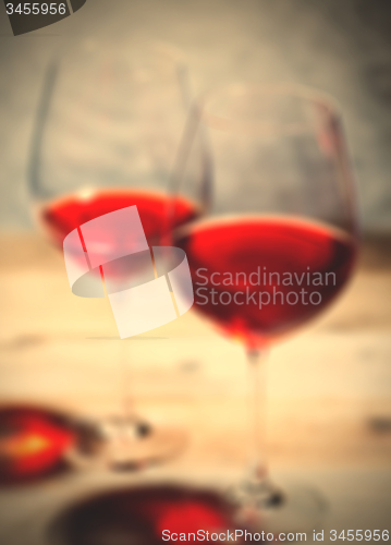 Image of red wine in two goblets. romantic blur