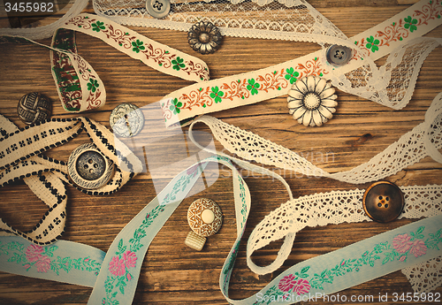 Image of vintage buttons, lace, tape and ribbons