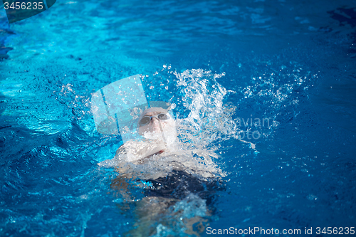 Image of swimmer excercise on indoor swimming poo