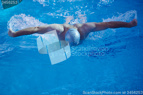 Image of swimmer excercise on indoor swimming poo