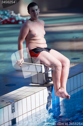Image of child group  at swimming pool school class