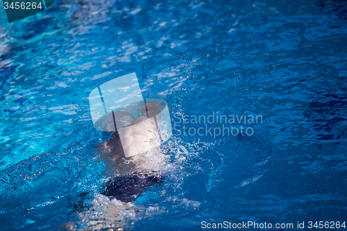 Image of swimmer excercise on indoor swimming poo