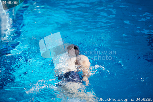 Image of swimmer excercise on indoor swimming poo