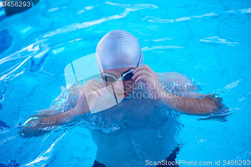 Image of swimmer excercise on indoor swimming poo