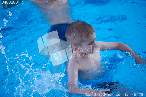 Image of child portrait on swimming pool