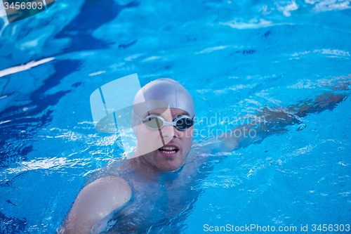 Image of swimmer excercise on indoor swimming poo