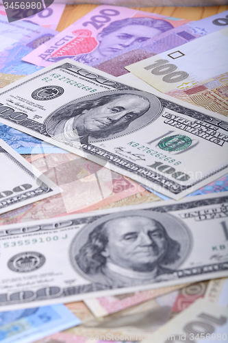 Image of Ukrainian hryvnia and the american dollars