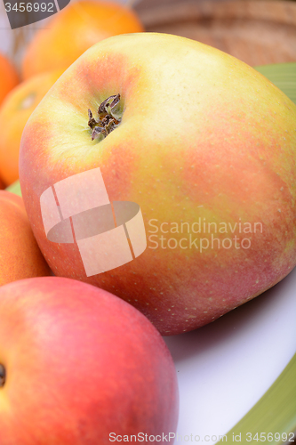 Image of many different fruits for the health of the entire family, peach, mandarin, apple