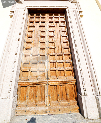 Image of door    in italy old ancian wood and traditional  texture nail