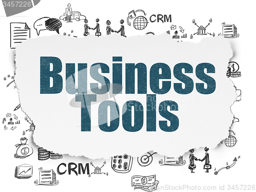Image of Finance concept: Business Tools on Torn Paper background
