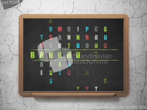 Image of Finance concept: word Bankruptcy in solving Crossword Puzzle