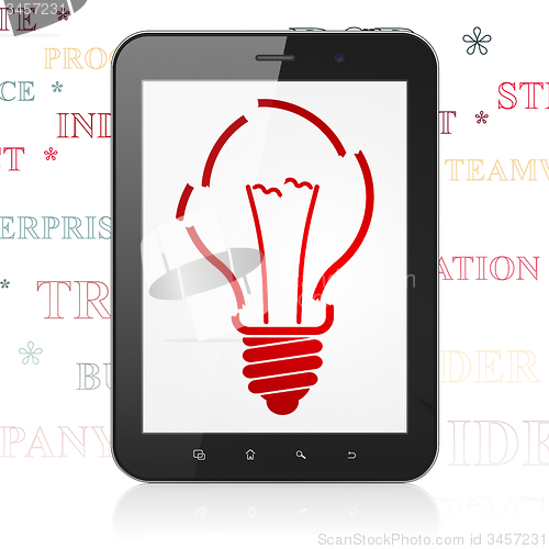 Image of Finance concept: Tablet Computer with Light Bulb on display