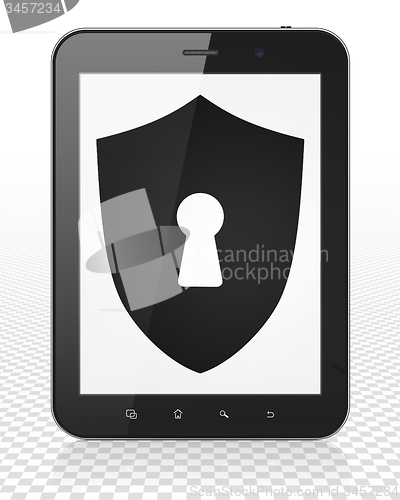 Image of Protection concept: Tablet Pc Computer with Shield With Keyhole on display