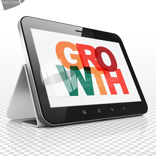 Image of Finance concept: Tablet Computer with Growth on  display