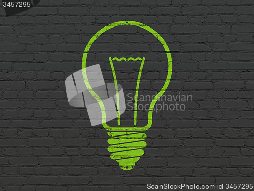 Image of Business concept: Light Bulb on wall background