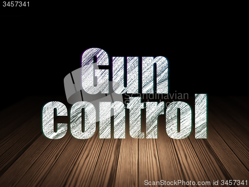 Image of Privacy concept: Gun Control in grunge dark room