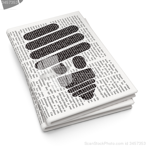 Image of Finance concept: Energy Saving Lamp on Newspaper background