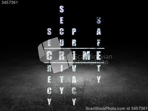 Image of Security concept: word Crime in solving Crossword Puzzle