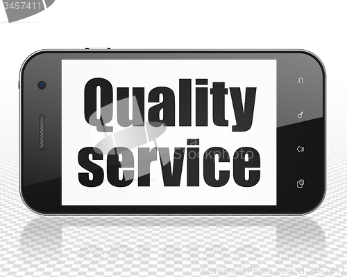 Image of Business concept: Smartphone with Quality Service on display