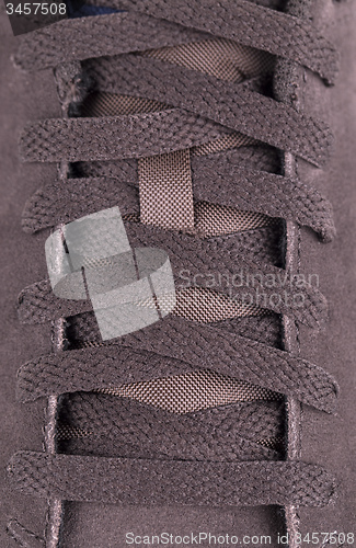 Image of close-up laces on the brown boots