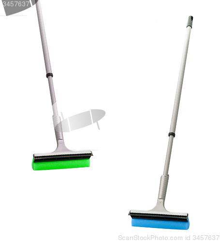 Image of plastic brooms isolated on white