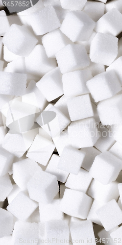 Image of white sugar in cubes texture background
