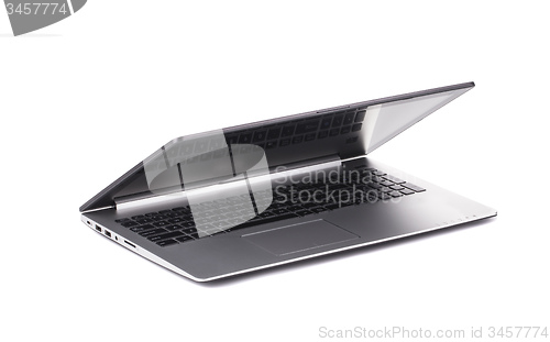 Image of Silver laptop half closed on white background