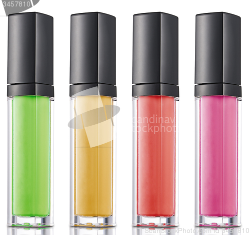 Image of Colorful nailpolish in a row isolated over white